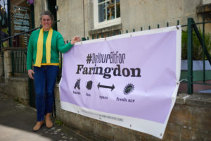 Cllr Bethia Thomas with new Covid-safety signage in Faringdon